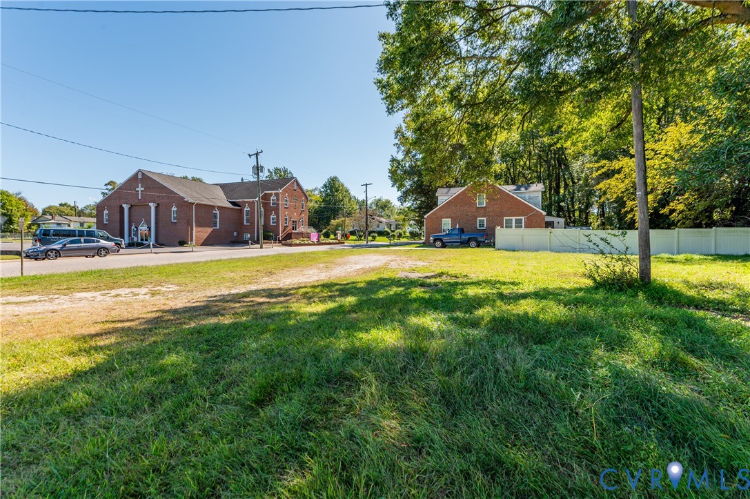 1304 Arlington Road Hopewell, VA 23860 - Photo 15 of 16 a view of a house with a big yard and large trees