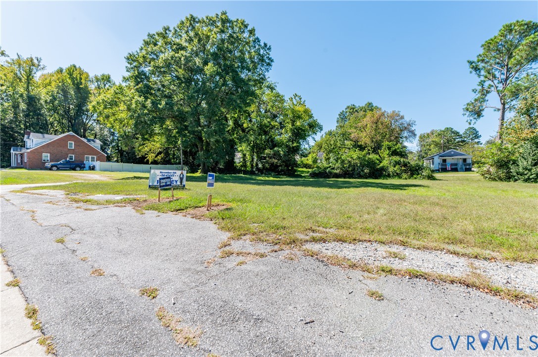 1304 Arlington Road Hopewell, VA 23860 - Photo 5 of 16 a view of a swimming pool with a yard and large trees