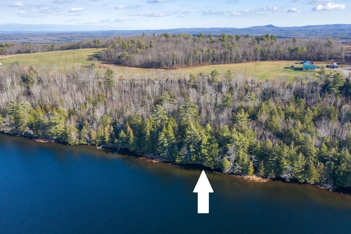 Waterfront with white arrow