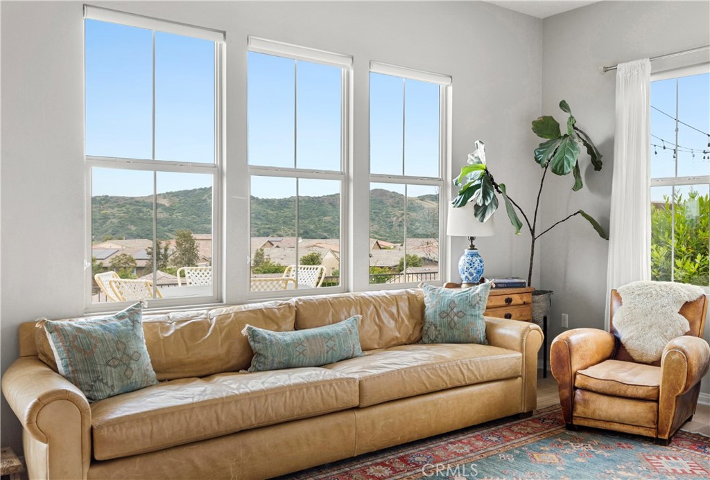 75 Promesa Avenue Rancho Mission Viejo, CA 92694 - Photo 11 of 47 a living room with furniture and a large window