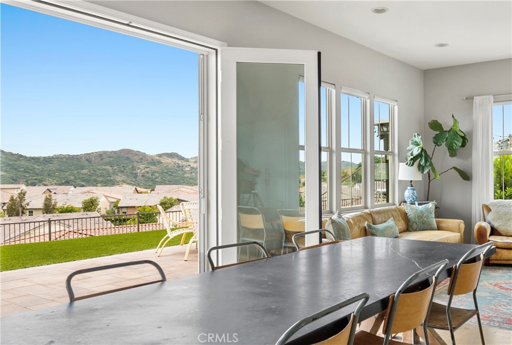 75 Promesa Avenue Rancho Mission Viejo, CA 92694 - Photo 14 of 47 a living room with furniture floor to ceiling window and wooden floor