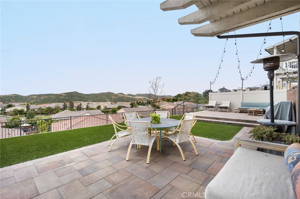 75 Promesa Avenue Rancho Mission Viejo, CA 92694 - Photo 21 of 47 a white house with a big yard and a patio