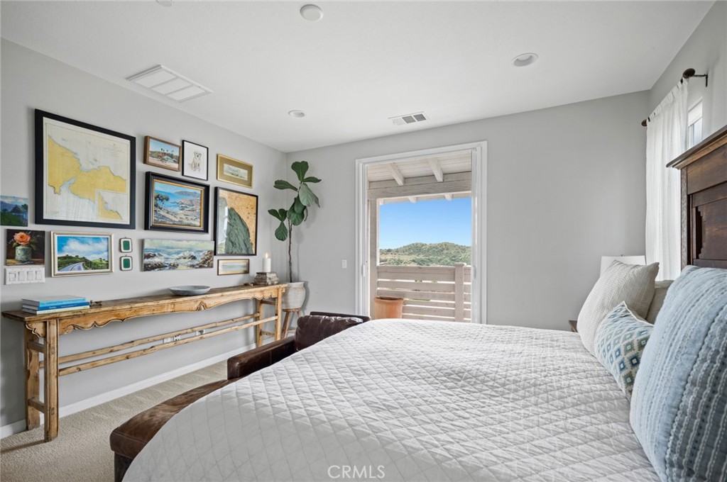 75 Promesa Avenue Rancho Mission Viejo, CA 92694 - Photo 25 of 47 a bedroom with a bed and a large window