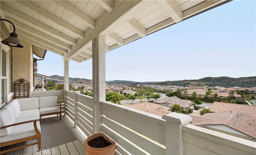 75 Promesa Avenue Rancho Mission Viejo, CA 92694 - Photo 27 of 47 a view of a balcony with couches and wooden floor
