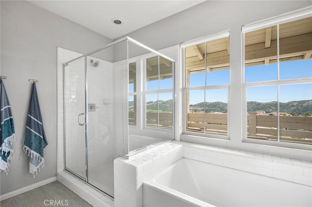 75 Promesa Avenue Rancho Mission Viejo, CA 92694 - Photo 33 of 47 a bathroom with a bathtub and a shower