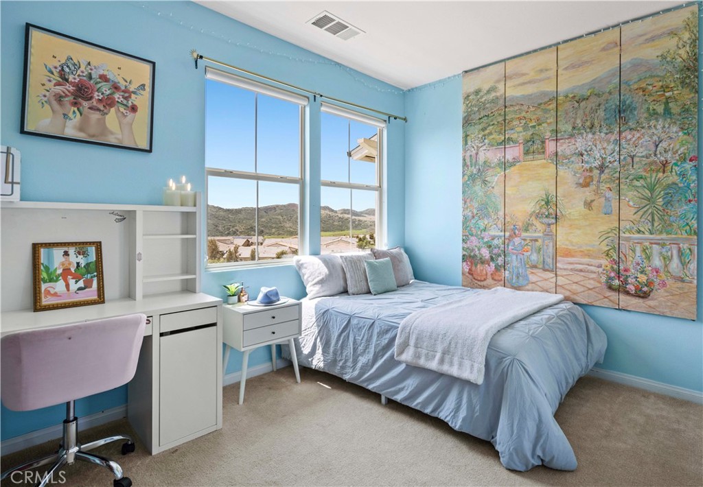 75 Promesa Avenue Rancho Mission Viejo, CA 92694 - Photo 36 of 47 a bedroom with a bed window and a table