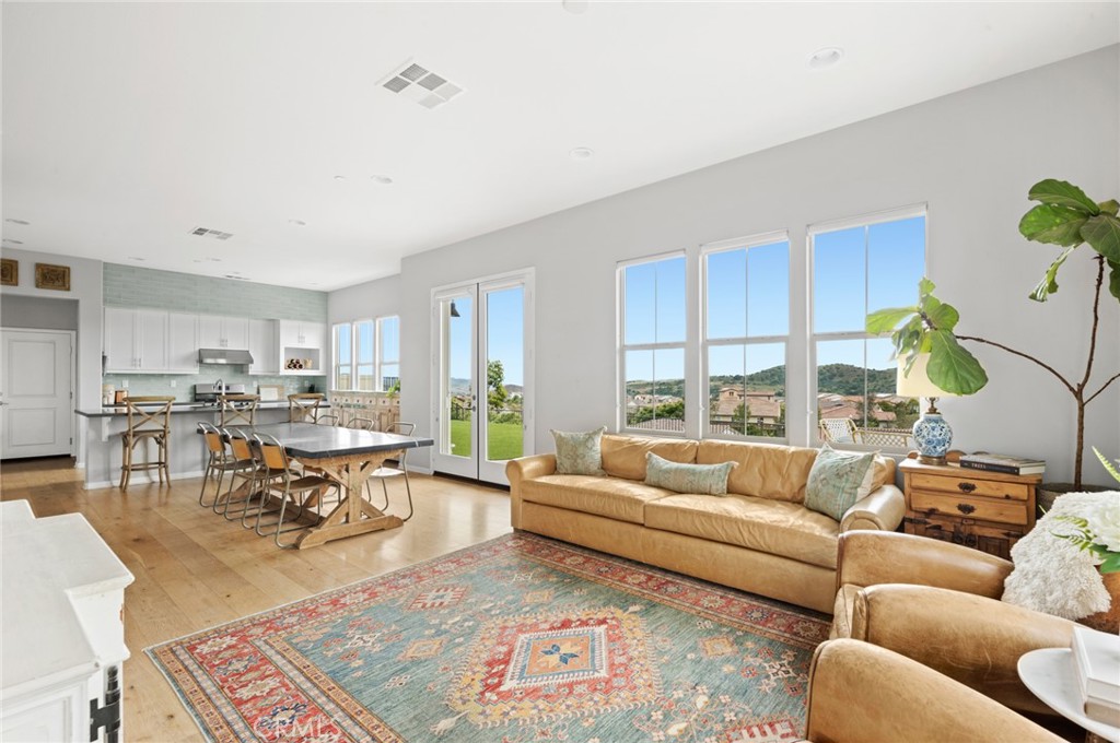 75 Promesa Avenue Rancho Mission Viejo, CA 92694 - Photo 8 of 47 a living room with furniture dining area and a table