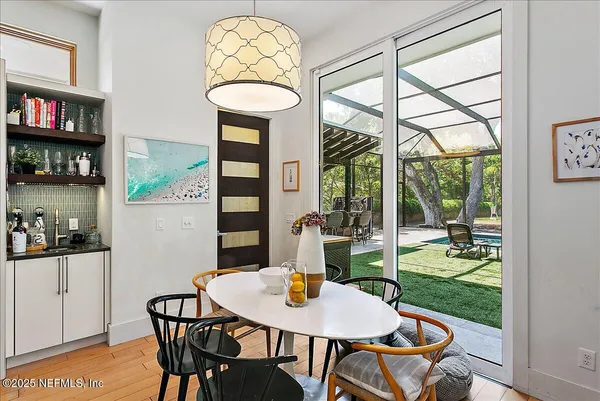 a view of a dining room with furniture window and outside view