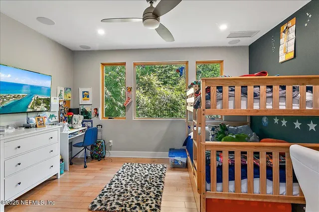 a bedroom with furniture a rug and a window