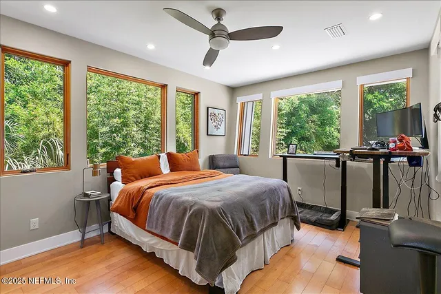 a bed room with a bed and a window