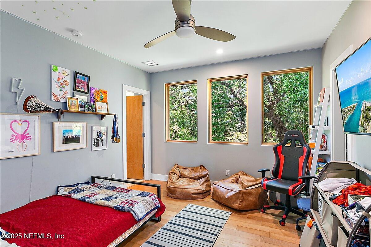 2446 Seminole Road Atlantic Beach, FL 32233 - Photo 19 of 45 a bedroom with furniture and a large window