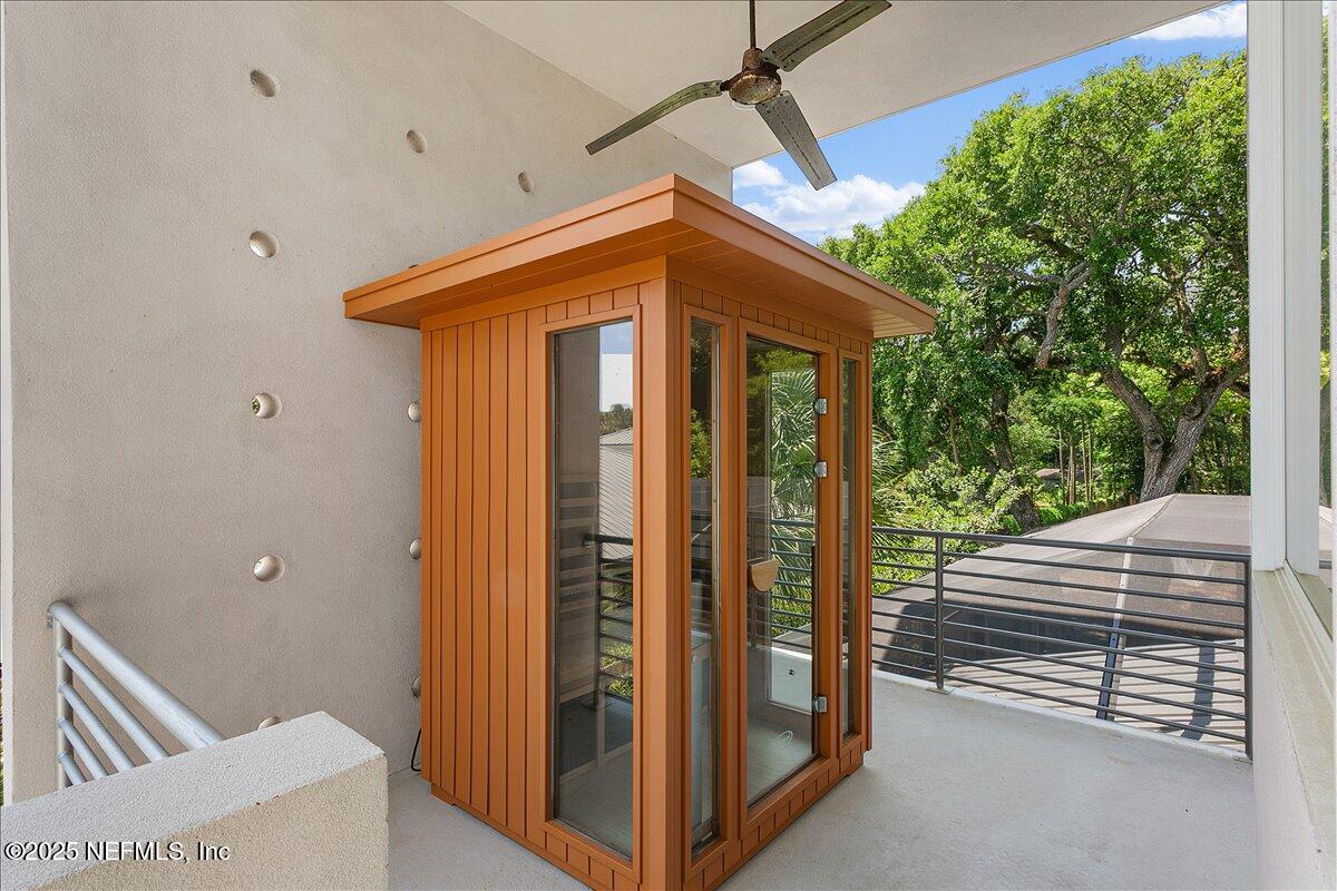 2446 Seminole Road Atlantic Beach, FL 32233 - Photo 23 of 45 a view of a porch with wooden floor and stairs
