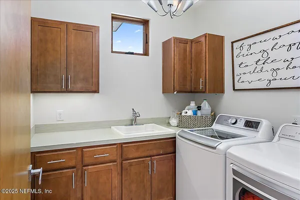 a dining room with furniture and a floor to ceiling window