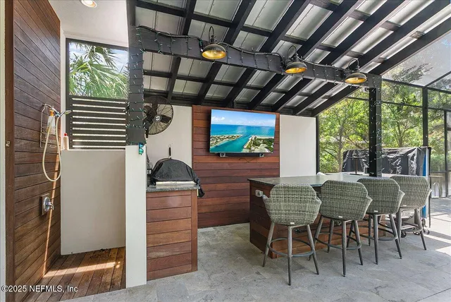 a view of a swimming pool with a patio and a yard