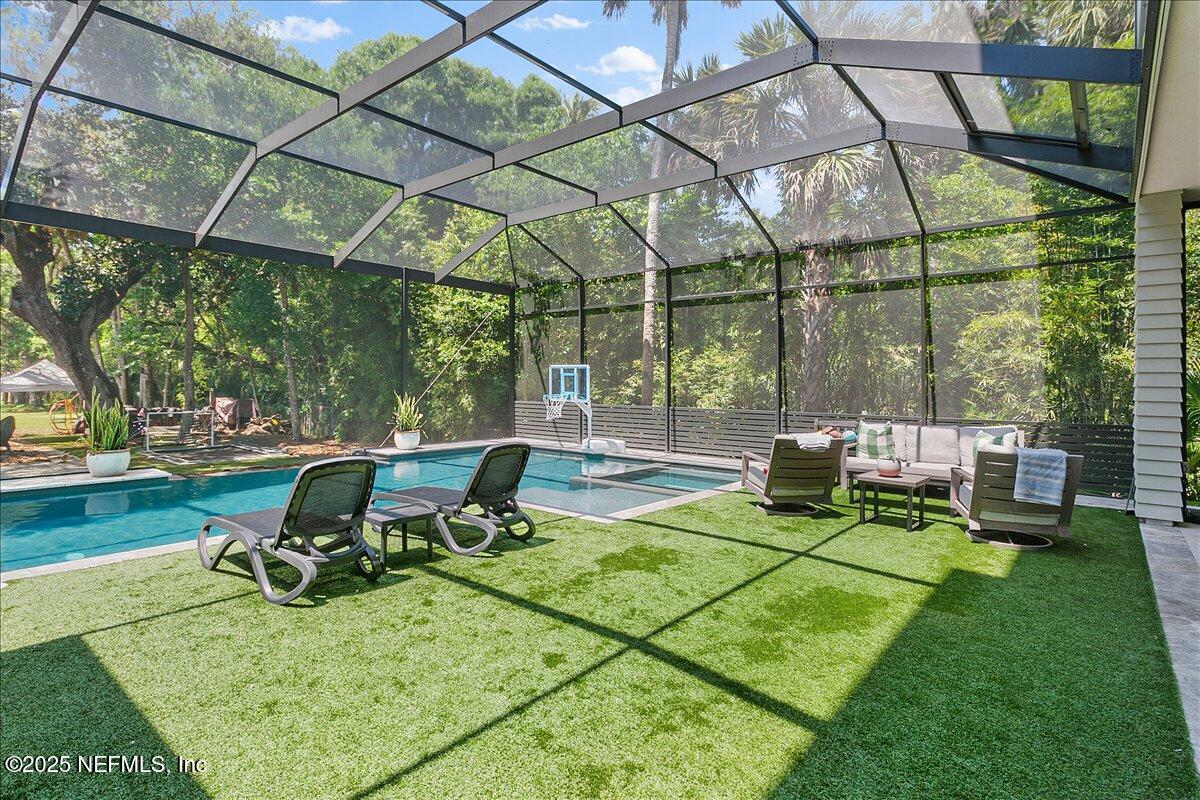 2446 Seminole Road Atlantic Beach, FL 32233 - Photo 30 of 45 a view of a chair and table in backyard of the house