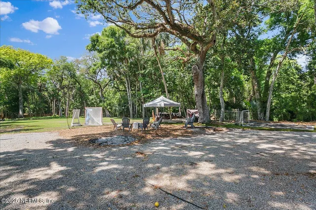 a view of a road with trees in the background