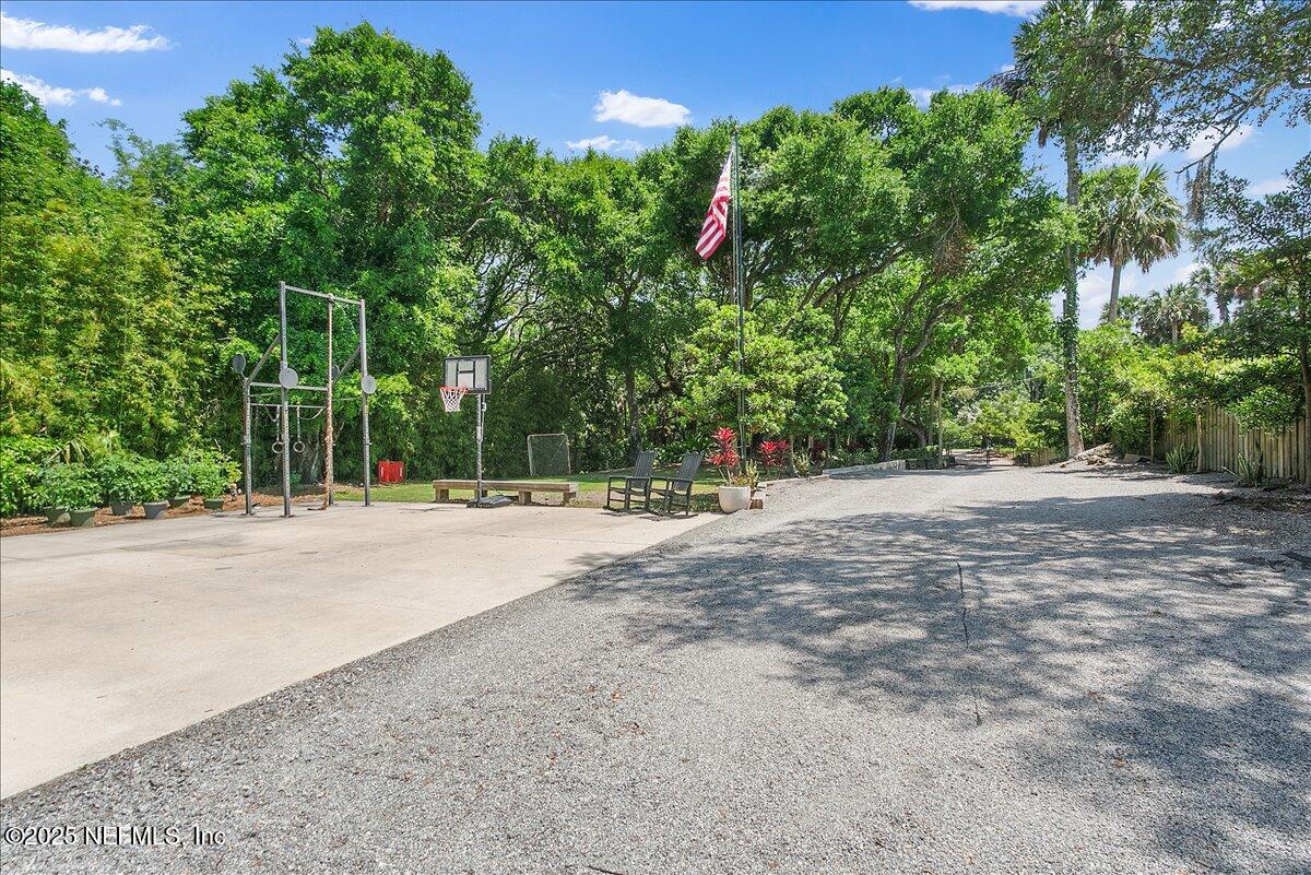 2446 Seminole Road Atlantic Beach, FL 32233 - Photo 36 of 45 a view of a road with trees in the background