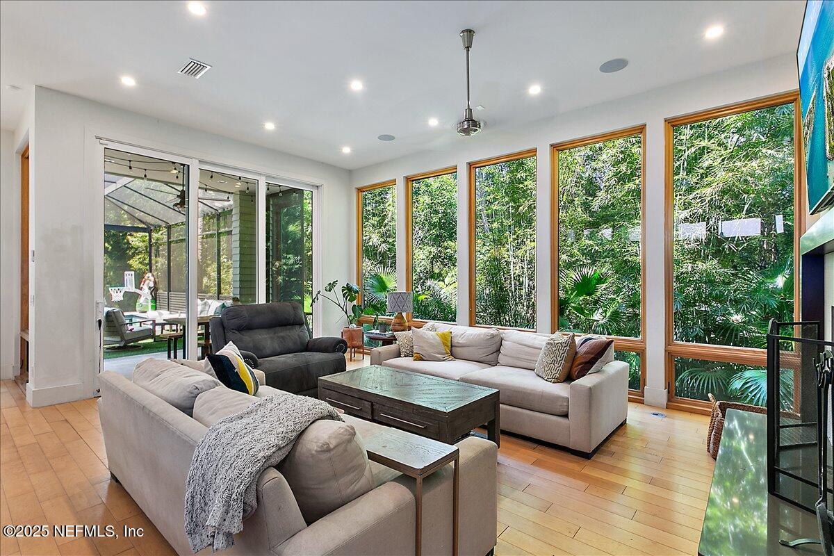 2446 Seminole Road Atlantic Beach, FL 32233 - Photo 6 of 45 a living room with furniture and floor to ceiling windows