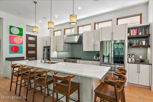 a dinning area with furniture and kitchen view