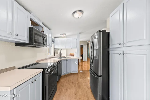 a spacious bedroom with a bed and a window