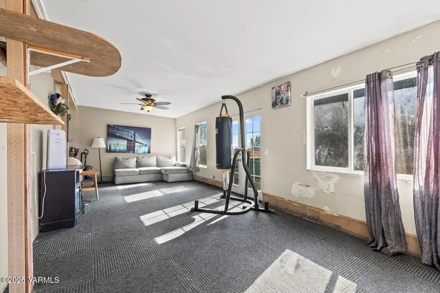 a view of a patio with a table and chairs