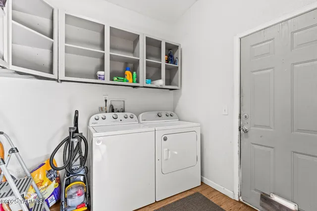 a view of a backyard with a snow on the road