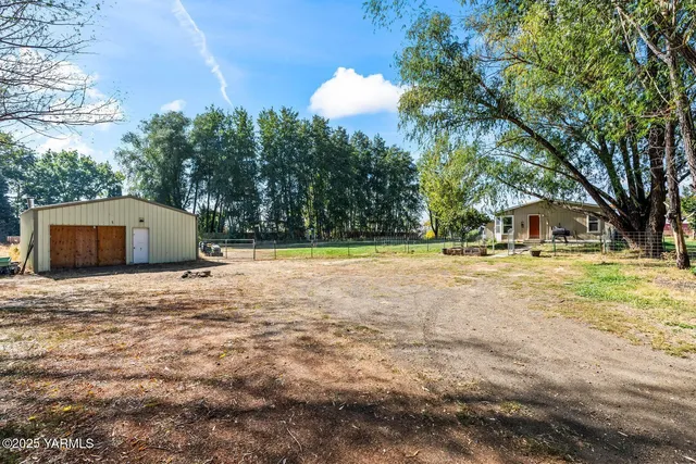 a house with trees in the background