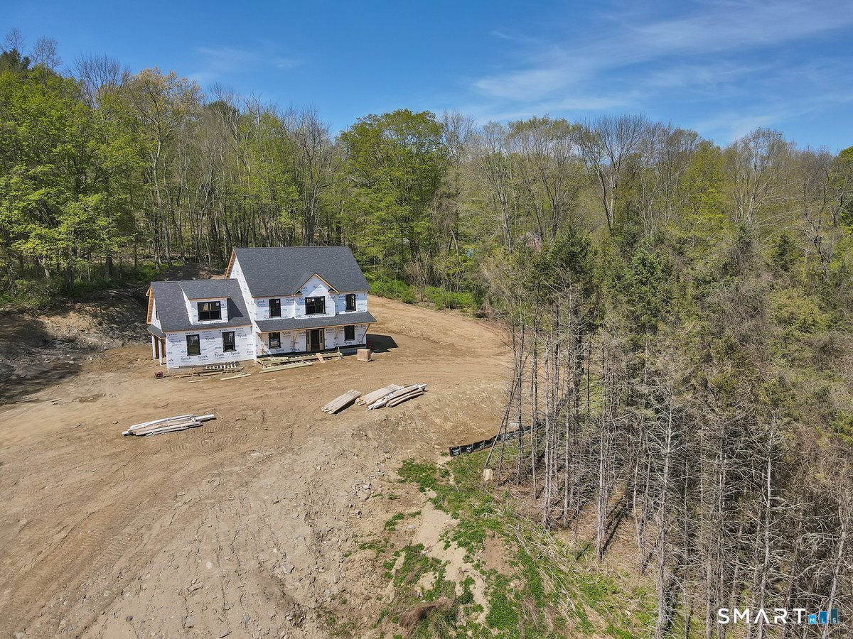 106 South Street Extension Coventry, CT 06238 - Photo 2 of 33 a view of a houses with a road and a yard