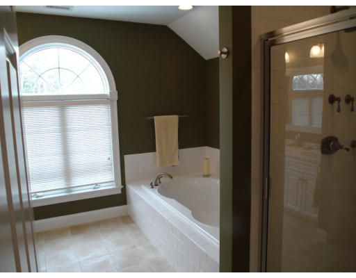 23 Bird Hill Road Lexington, MA 02421 - Photo 15 of 30 a bathroom with a bathtub and a shower