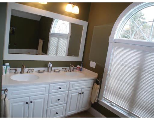 23 Bird Hill Road Lexington, MA 02421 - Photo 16 of 30 a bathroom with a sink and a mirror