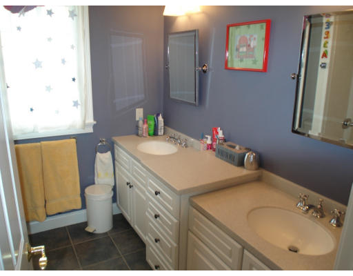 23 Bird Hill Road Lexington, MA 02421 - Photo 18 of 30 a bathroom with a sink and a mirror