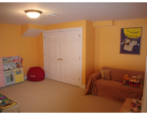 23 Bird Hill Road Lexington, MA 02421 - Photo 23 of 30 a bedroom with a bed and a couch