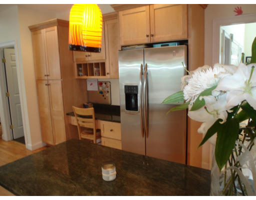 23 Bird Hill Road Lexington, MA 02421 - Photo 8 of 30 a kitchen with stainless steel appliances a refrigerator and a more cabinets
