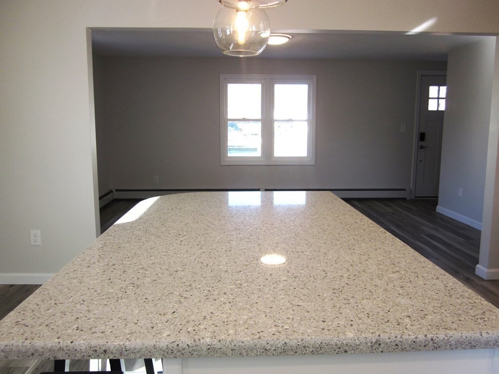 6 James Street Webster, MA 01570 - Photo 12 of 37 a view of a livingroom with a ceiling fan and window