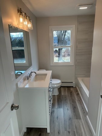 6 James Street Webster, MA 01570 - Photo 18 of 37 a bathroom with a sink and a mirror