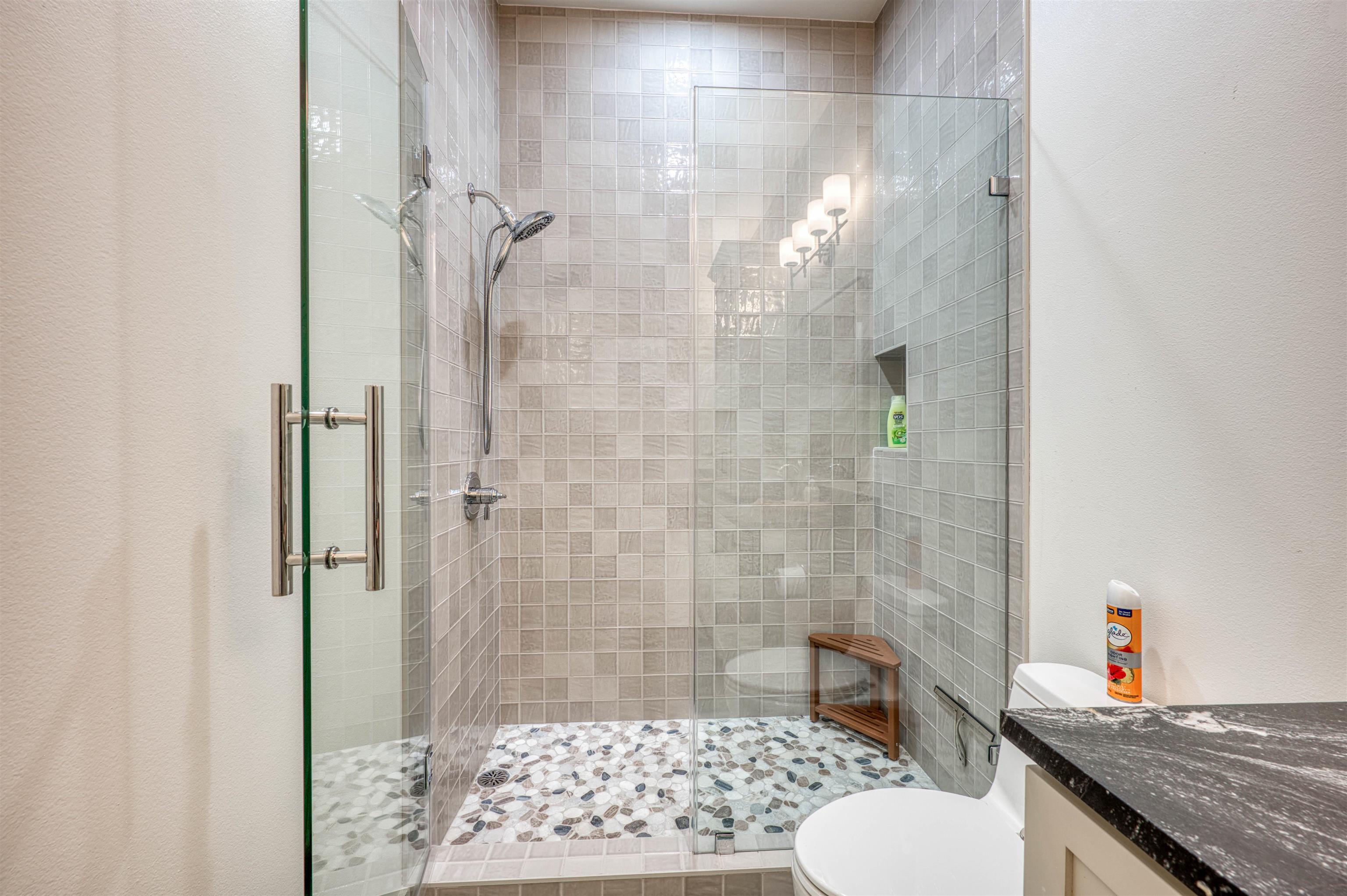 2001 Granite Cove Road Kingsland, TX 78639 - Photo 20 of 42 a bathroom with a granite countertop shower a toilet and a sink
