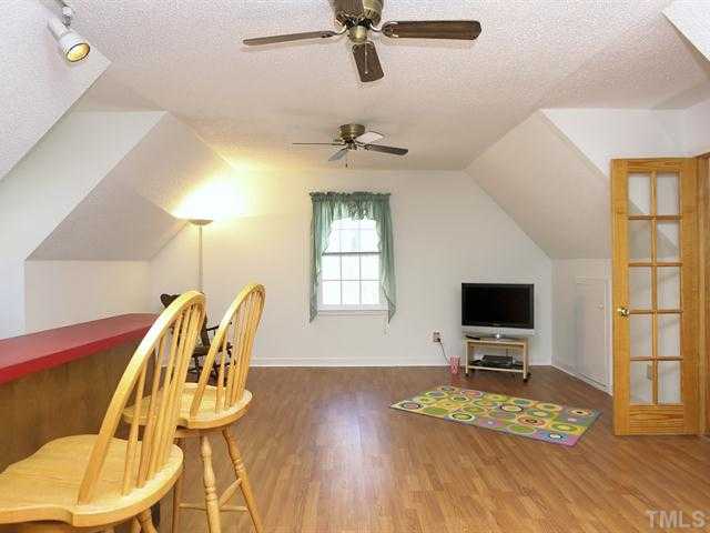 706 Young Road Angier, NC 27501 - Photo 14 of 25 a view of a workspace with furniture and a window