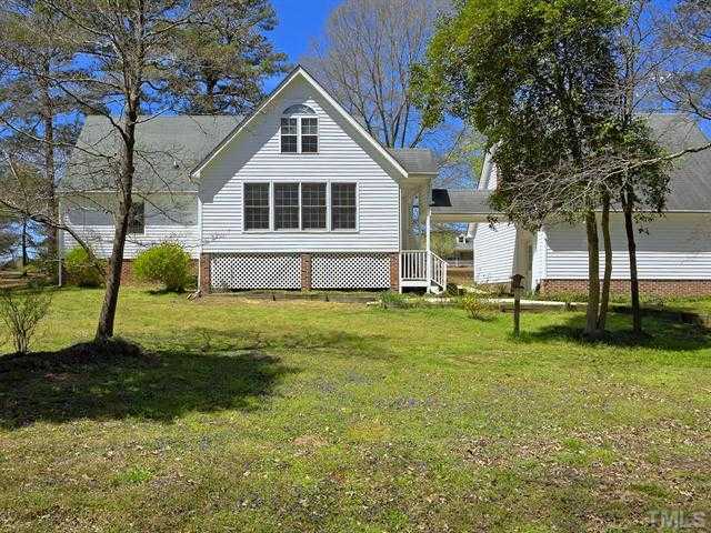 706 Young Road Angier, NC 27501 - Photo 20 of 25 a front view of a house with a yard