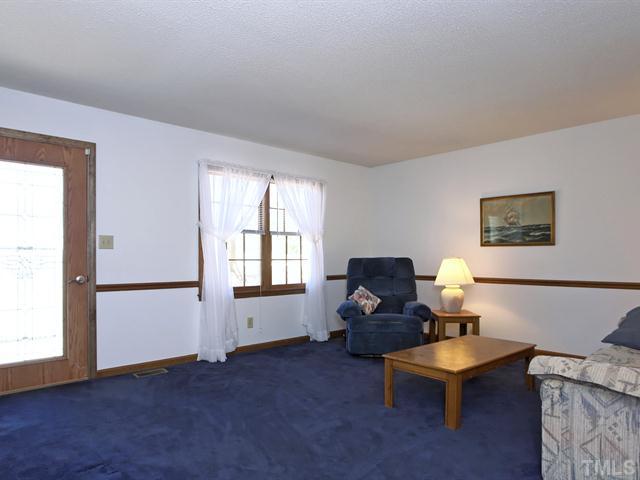 706 Young Road Angier, NC 27501 - Photo 2 of 25 a living room with furniture and a window