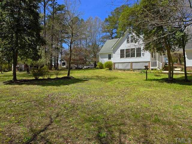 706 Young Road Angier, NC 27501 - Photo 21 of 25 a front view of a house with a yard