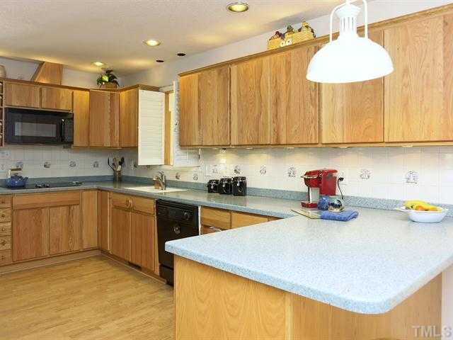 706 Young Road Angier, NC 27501 - Photo 3 of 25 a kitchen with a sink a stove and cabinets