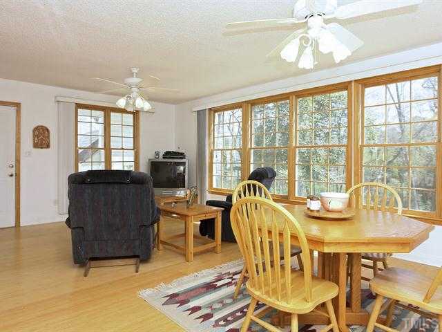 706 Young Road Angier, NC 27501 - Photo 7 of 25 a view of a dining room with furniture window and outside view