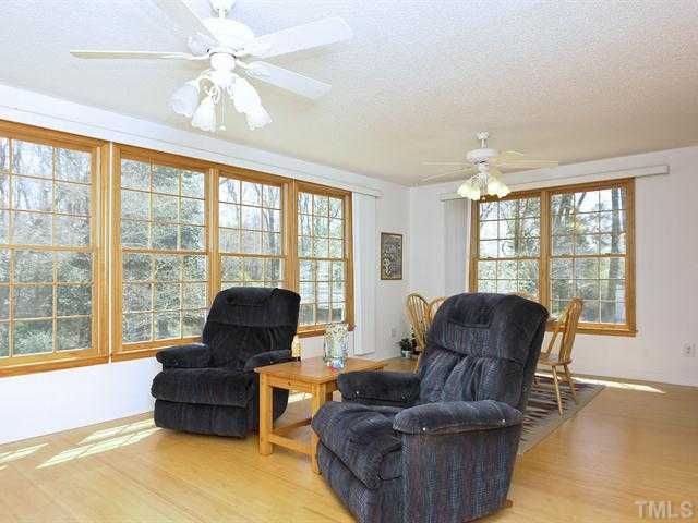 706 Young Road Angier, NC 27501 - Photo 8 of 25 a living room with furniture and a large window