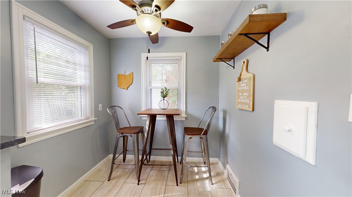 4042 Bushnell Road University Heights, OH 44118 - Photo 12 of 37 Dining room with ceiling fan and a healthy amount of sunlight
