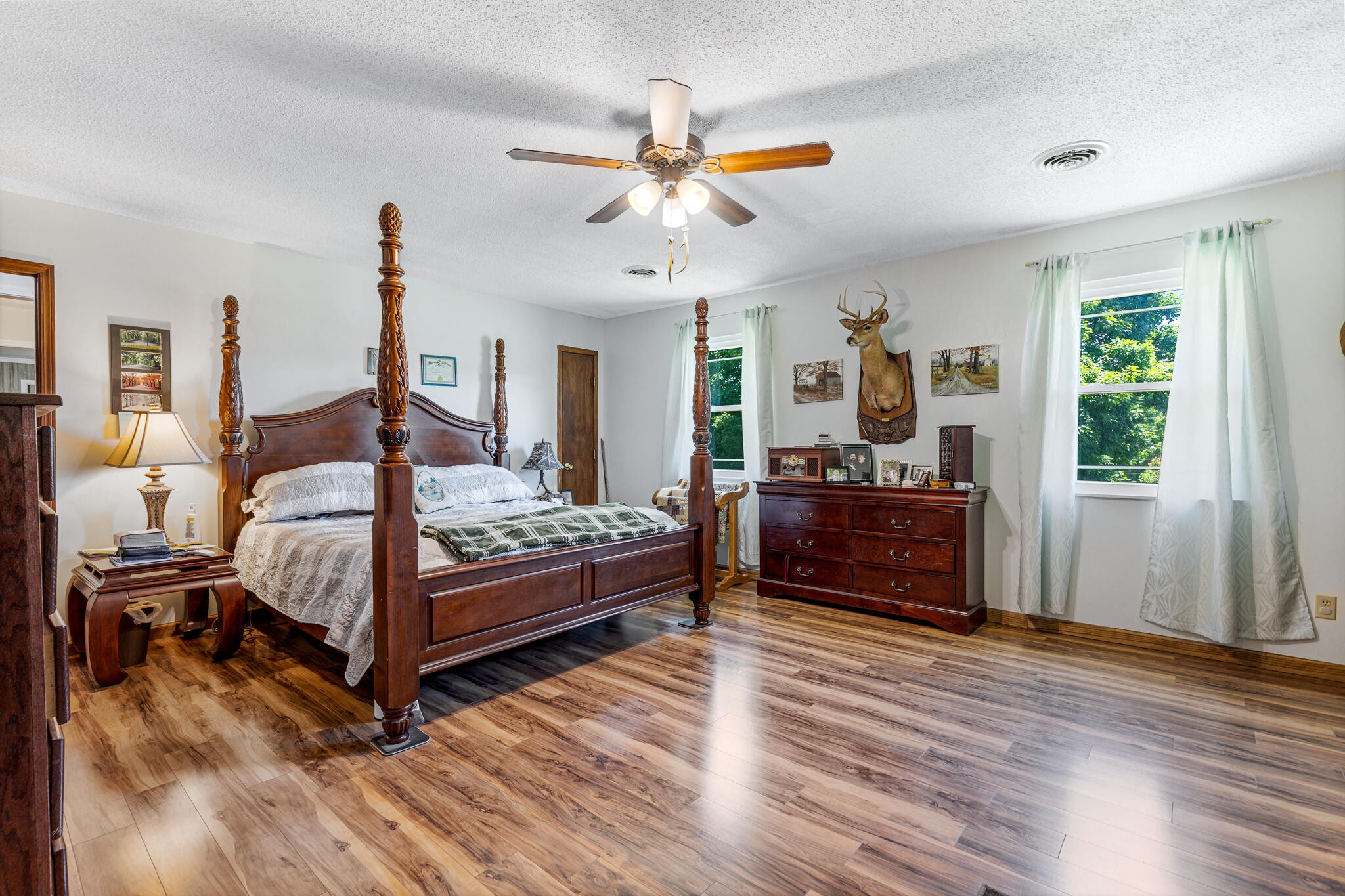 219 Corbin Lake Road Rutledge, TN 37861 - Photo 27 of 41 a bedroom with a bed and wooden floor