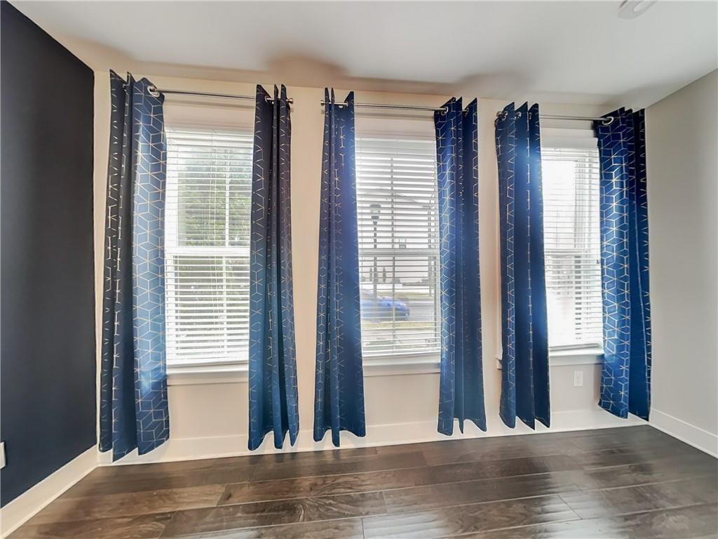 2038 Rockledge Road Northeast Atlanta, GA 30324 - Photo 11 of 21 a view of a room with a large window and wooden floor