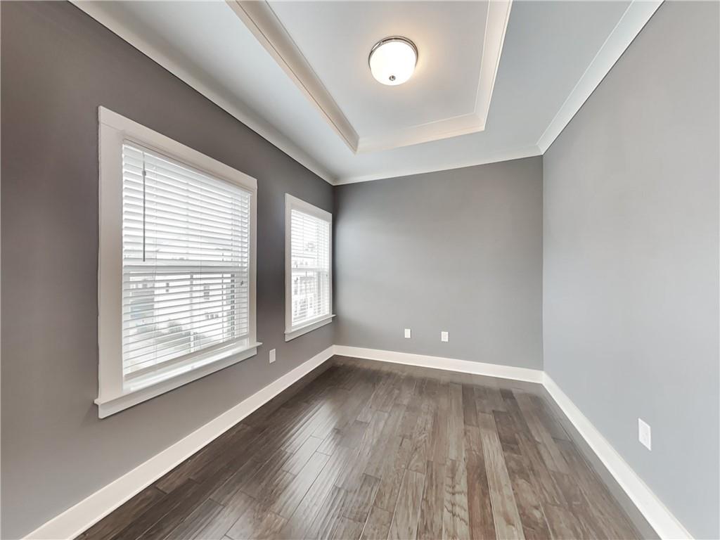 2038 Rockledge Road Northeast Atlanta, GA 30324 - Photo 14 of 21 wooden floor in an empty room with a window
