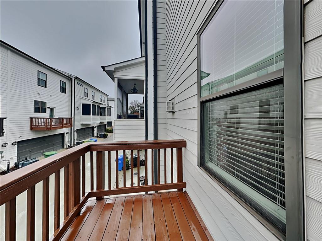 2038 Rockledge Road Northeast Atlanta, GA 30324 - Photo 17 of 21 a view of a balcony with wooden floor and stairs