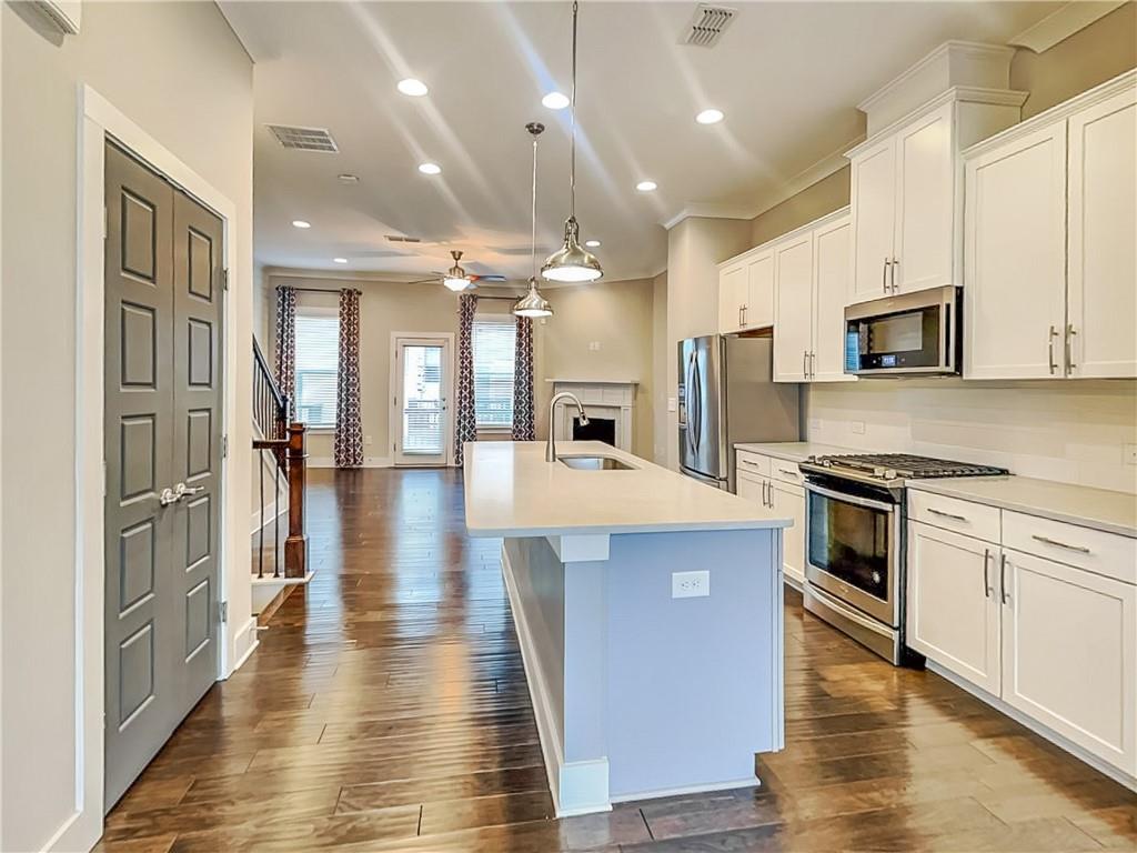 2038 Rockledge Road Northeast Atlanta, GA 30324 - Photo 2 of 21 a large kitchen with cabinets and stainless steel appliances