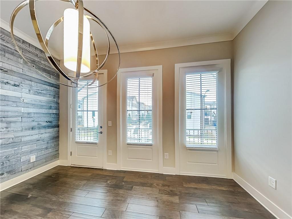 2038 Rockledge Road Northeast Atlanta, GA 30324 - Photo 5 of 21 an empty room with wooden floor and windows